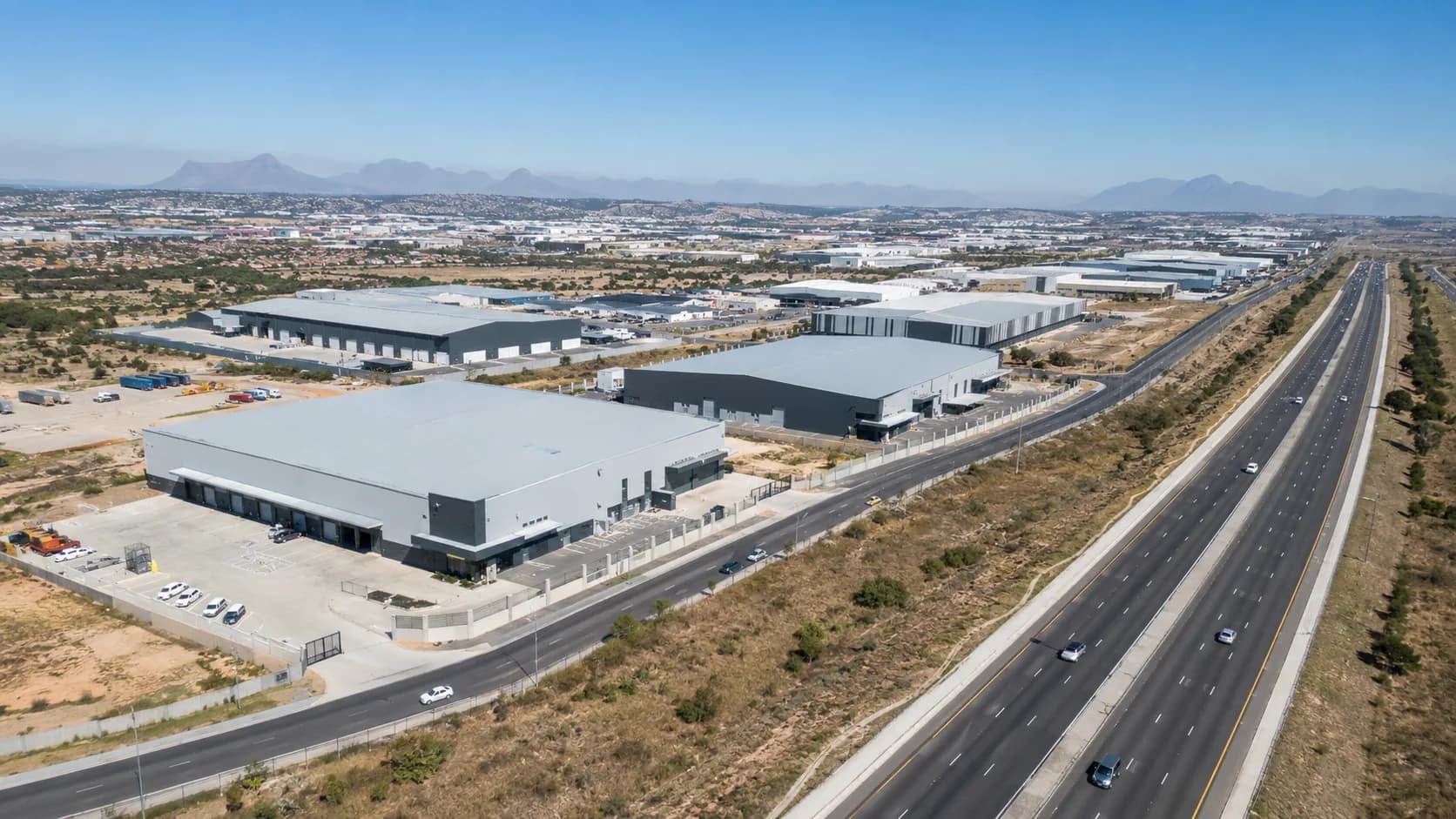 Aerial view of modern warehouses beside a major Gauteng highway and logistics corridor